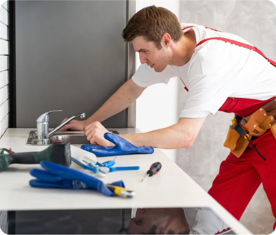 plumber working on a sink